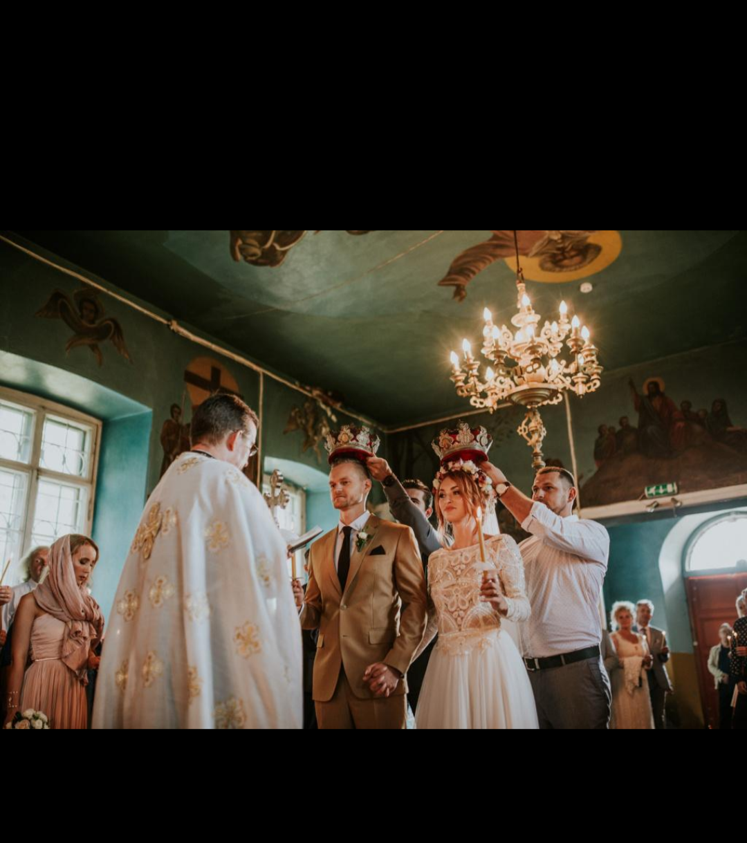 An Orthodox Christian wedding ceremony featuring the crowning of the bride and groom, symbolising their union in marriage.