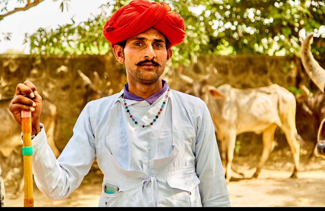 A person from the community in traditional dress.