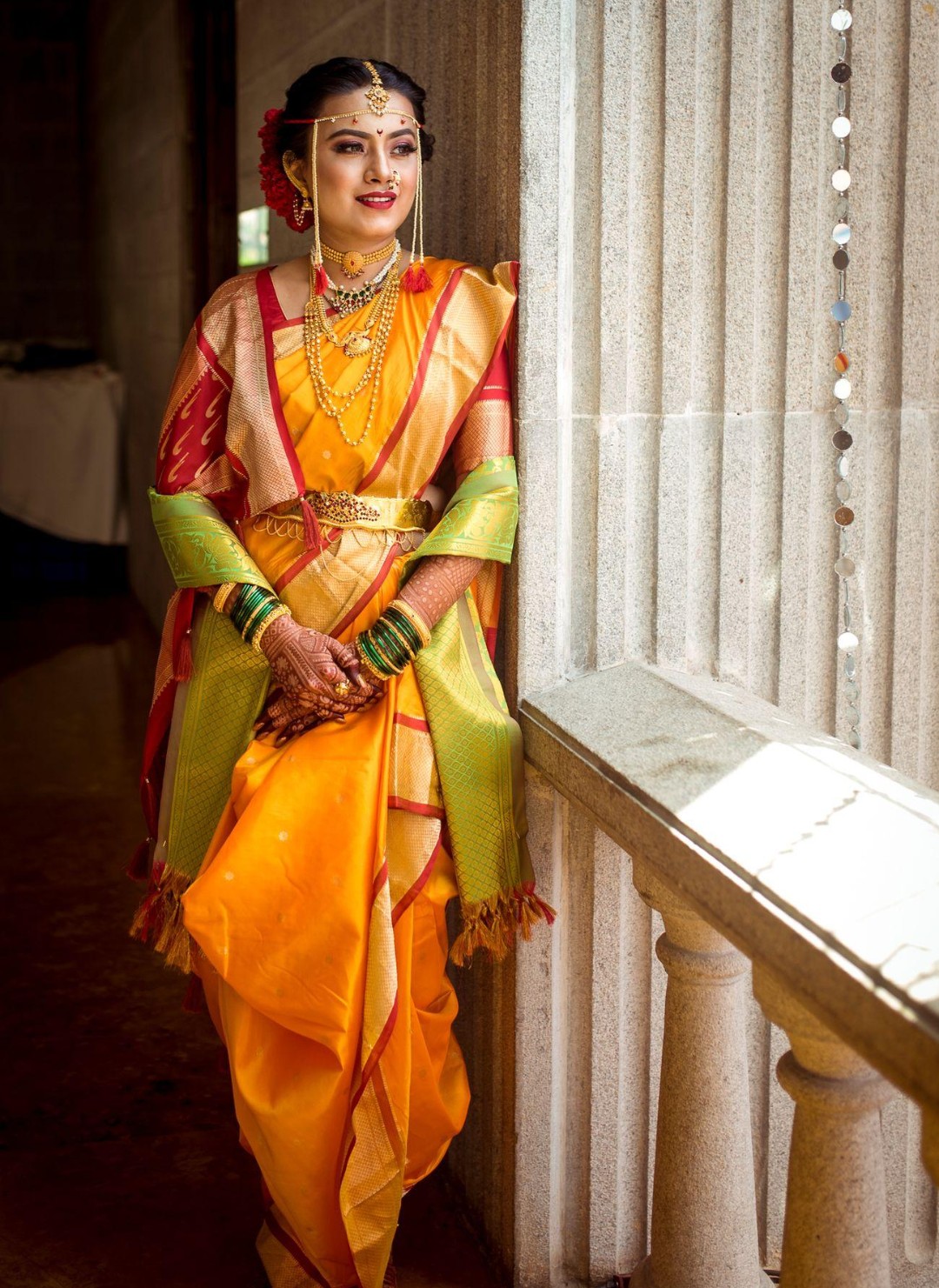 Traditional Maharashtrian attire, including the nauvari sari and pheta.