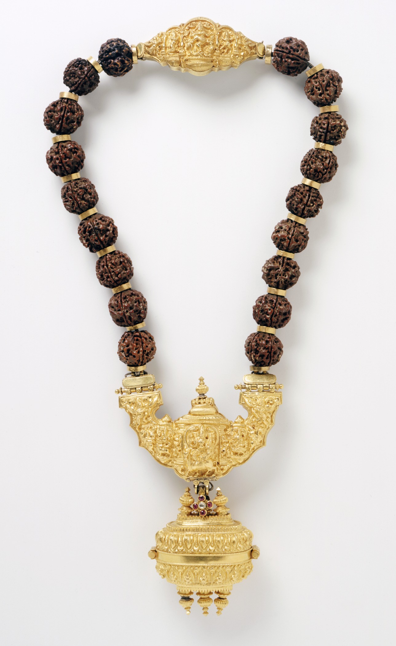 A necklace with pendant containing linga symbol of Shiva are worn by Lingayats. Rudraksha beads (shown above) and Vibhuti (sacred ash on forehead) are other symbols adopted as a constant reminder of one's principles of faith.
