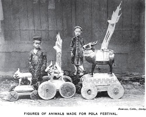Photograph (1916) of boys with their toy animals crafted for the Pola festival celebrated by the Dhanoje Kunbis.