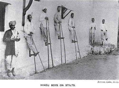 Kunbi Hindu boys on stilts during the Pola festival from early 20th century.