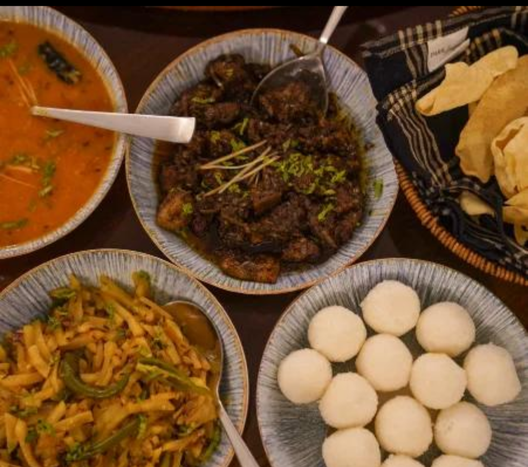 Pandhi curry and kadumbuttu, staples of Kodava cuisine.